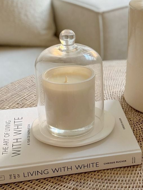 Glass candle cloche dome for home decor, featuring a clear glass cover suitable for displaying candles or decorative items.