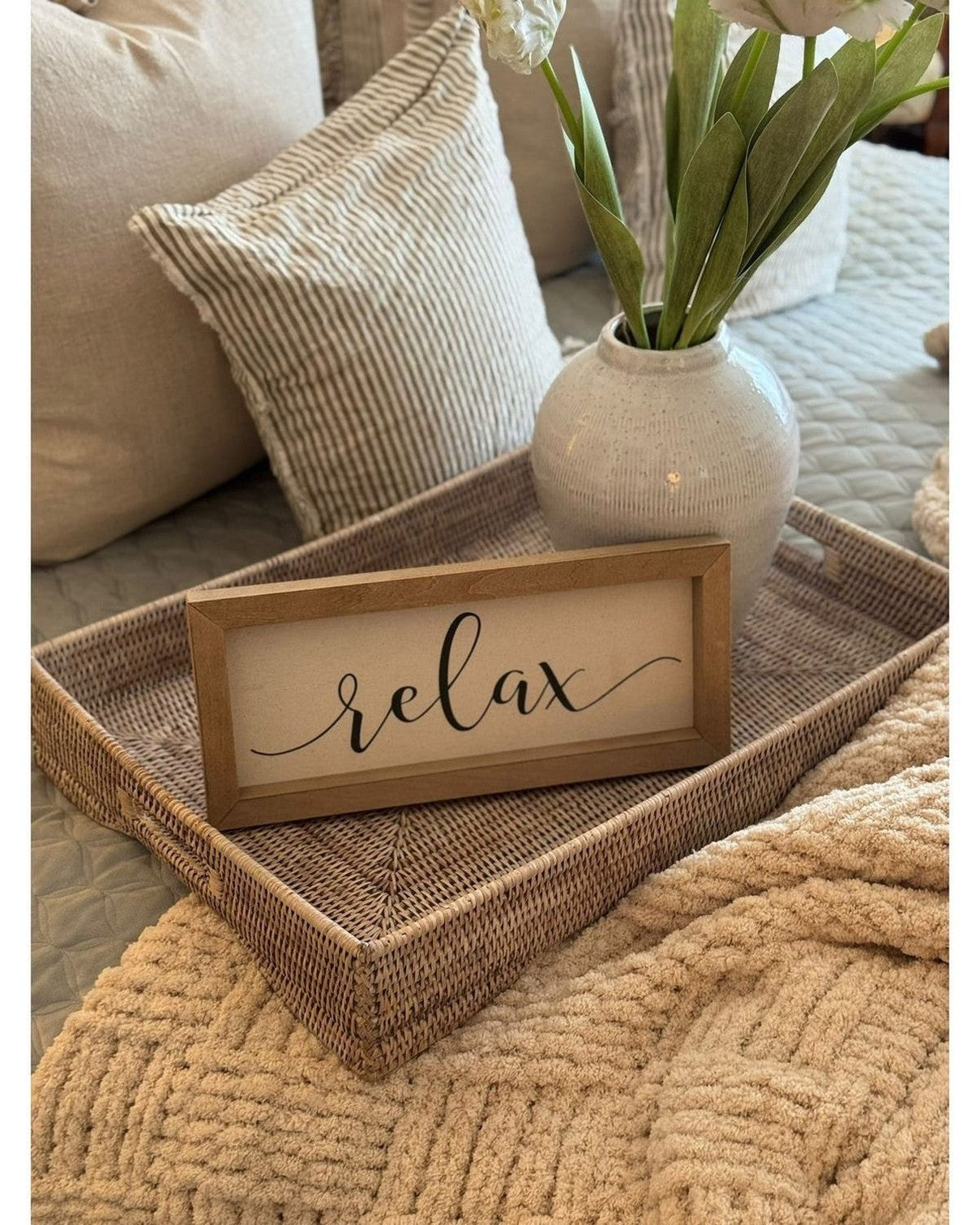 Lows rattan rectangle footed tray with handles for home decor, featuring natural woven rattan and sturdy footed design.