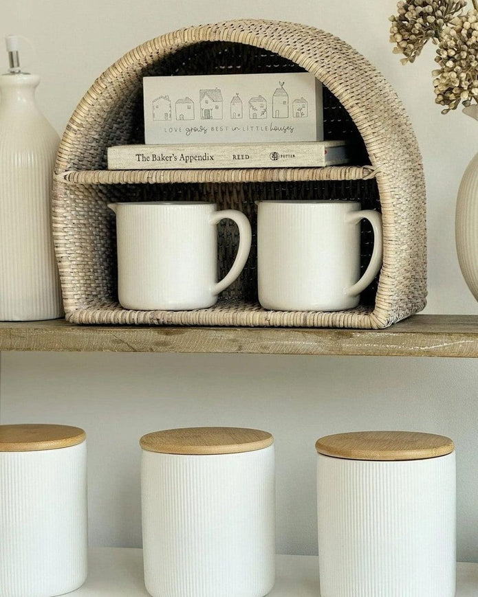 Lows rattan arched-shaped shelving unit for kitchen and dining, featuring open storage and natural woven design.