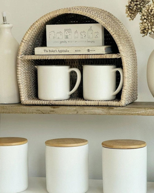 Lows rattan arched-shaped shelving unit for kitchen and dining, featuring open storage and natural woven design.
