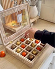 Lows rattan coffee pod and wax melt storage box for Nespresso capsules, ideal for kitchen and dining organization.