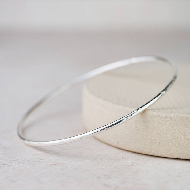 Sterling silver geo circle bangle bracelet from Lucy Kemp Jewellery, featuring a modern circular design for stylish wristwear.