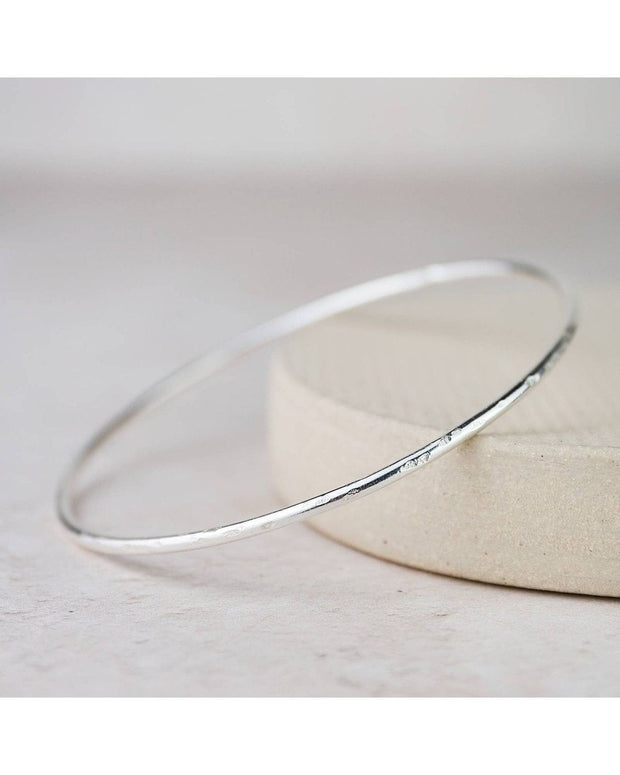 Sterling silver geo circle bangle bracelet from Lucy Kemp Jewellery, featuring a modern circular design for stylish wristwear.