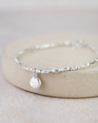 Sterling silver nugget charm bracelet by Lucy Kemp Jewellery featuring textured silver nuggets on a delicate chain.