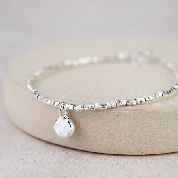 Sterling silver nugget charm bracelet by Lucy Kemp Jewellery featuring textured silver nuggets on a delicate chain.