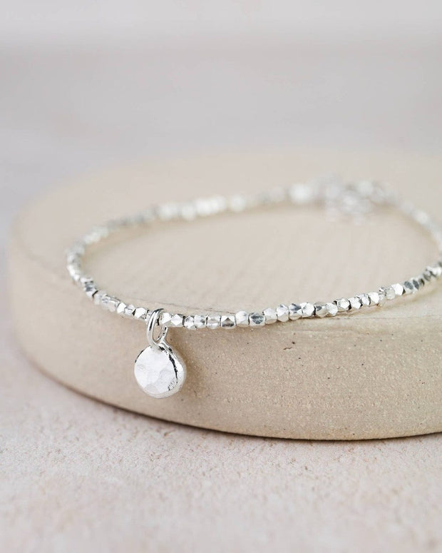 Sterling silver nugget charm bracelet by Lucy Kemp Jewellery featuring textured silver nuggets on a delicate chain.