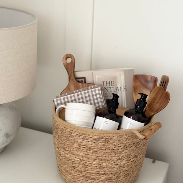 Spring-themed New Home Gift Basket by Lulu Loves Home with floral decorations and cozy home essentials.