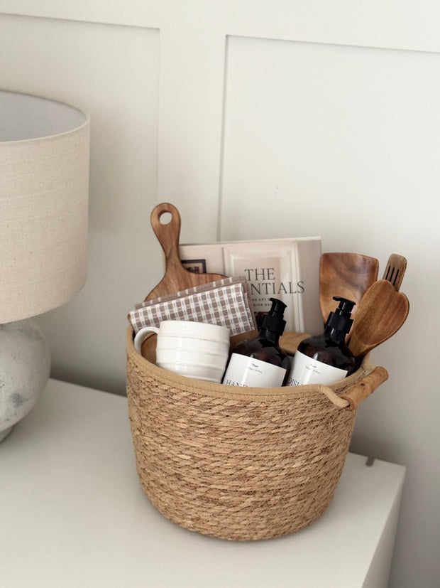 Spring-themed New Home Gift Basket by Lulu Loves Home with floral decorations and cozy home essentials.