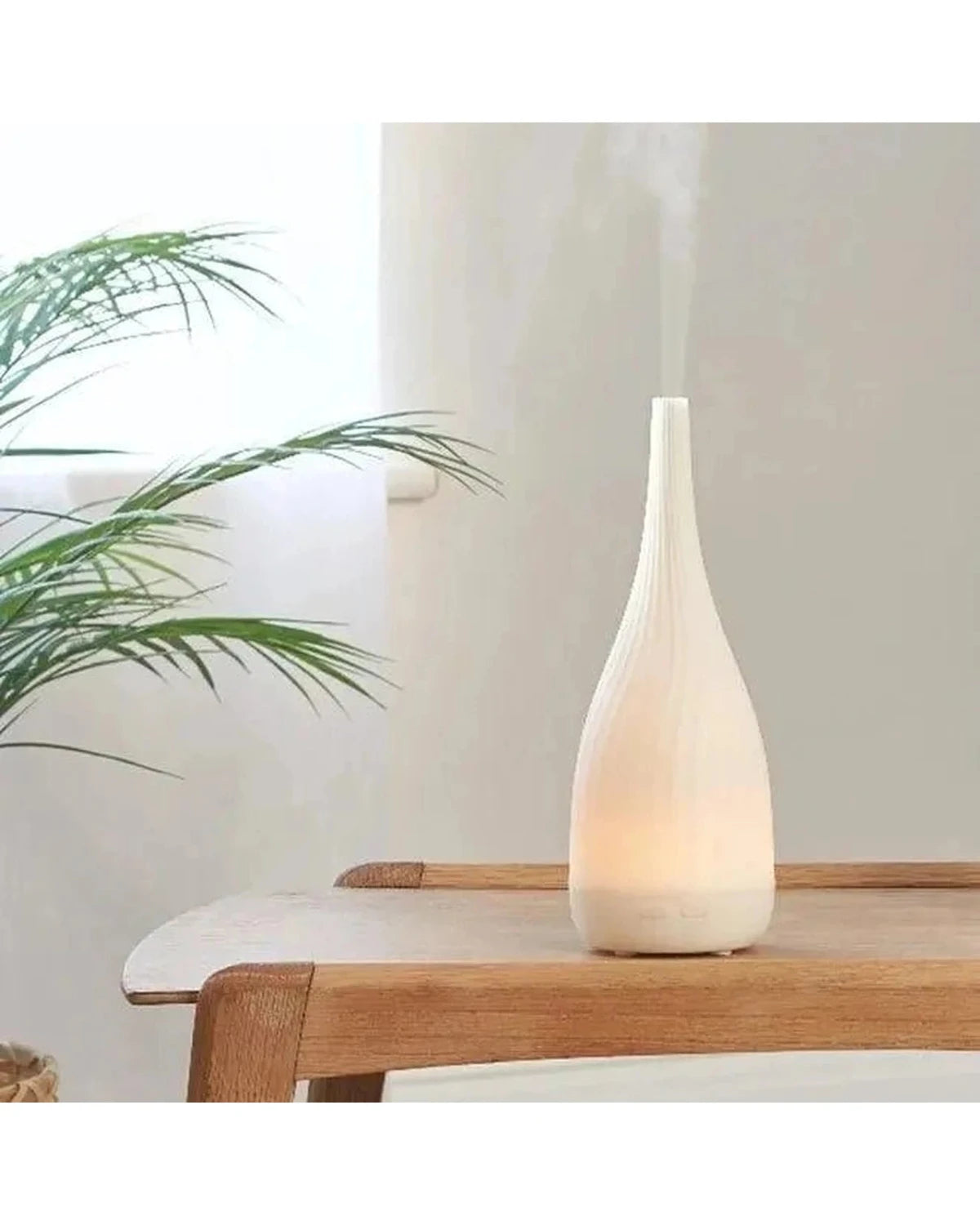 White Thalia Aroma Mist Diffuser by Made By Zen, a sleek home fragrance device for soothing aroma mist.