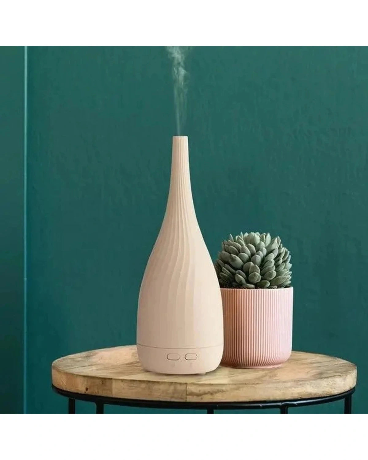White Thalia Aroma Mist Diffuser by Made By Zen, a stylish home fragrance diffuser with a sleek design and soothing mist feature.