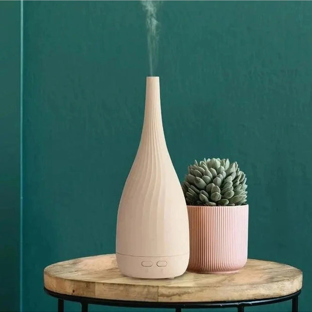 White Thalia Aroma Mist Diffuser by Made By Zen, a stylish home fragrance diffuser with a sleek design and soothing mist feature.