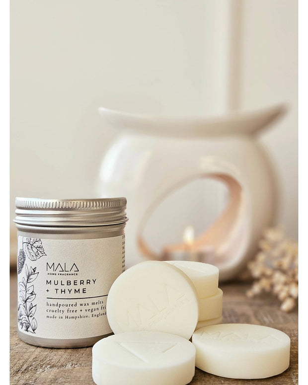 Luxury wax melt tins from Mala Home Fragrance featuring Mulberry and Thyme for Christmas home scent.