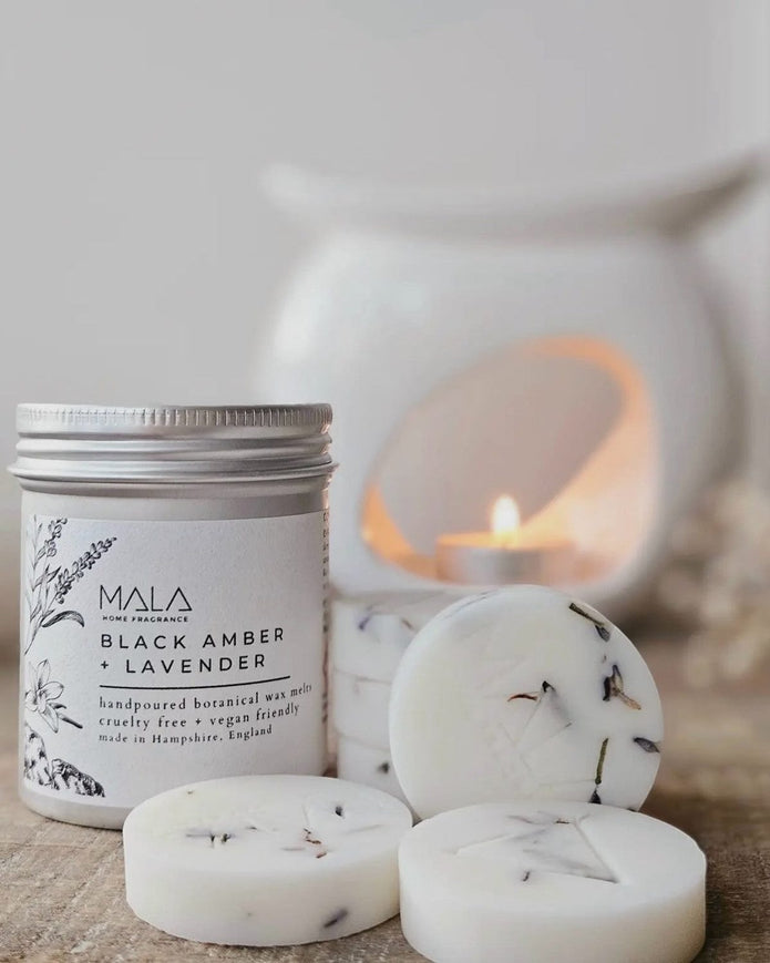Luxury wax melt tins by MALA Home Fragrance featuring Black Amber and Lavender for home scent enhancement.