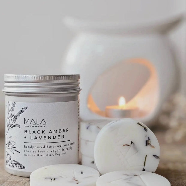 Luxury wax melt tins by MALA Home Fragrance featuring Black Amber and Lavender for home scent enhancement.