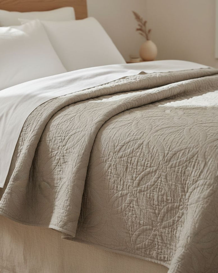 Malini Amity beige king size quilted bedspread with soft, textured fabric for a cozy, elegant bedroom look.
