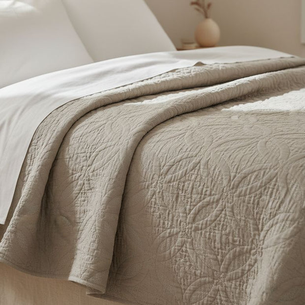 Malini Amity beige king size quilted bedspread with soft, textured fabric for a cozy, elegant bedroom look.
