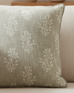 Beige block flower cushion cover by Malini, soft furnishings with floral pattern, square design, made of soft fabric.