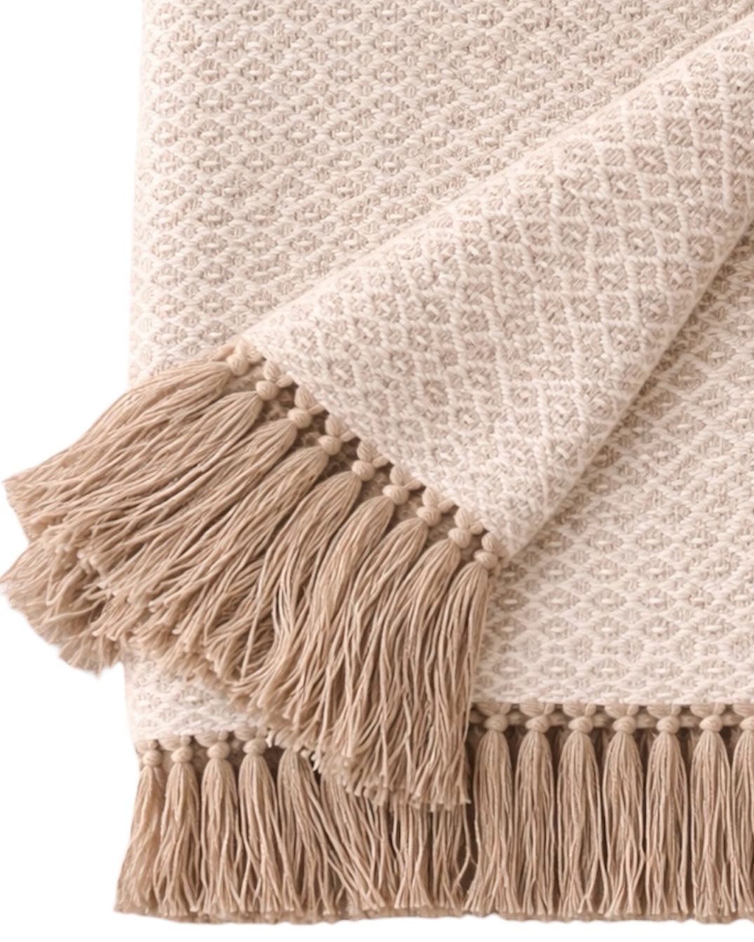 Beige Malini cotton throw with natural diamond weave, soft furnishings for cozy home decor.