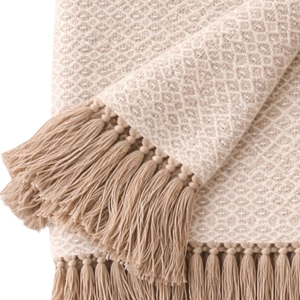 Beige Malini cotton throw with natural diamond weave, soft furnishings for cozy home decor.