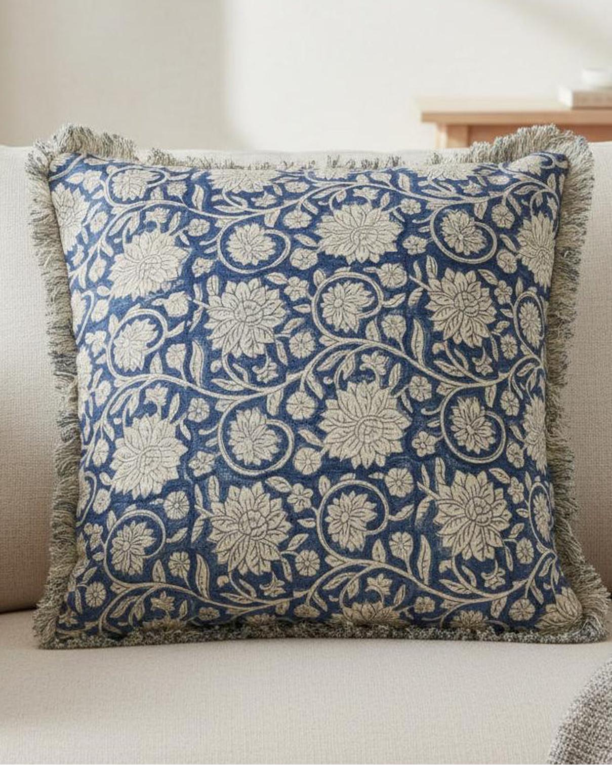 Blue floral trellis linen cushion cover by Malini, square soft furnishing with a vibrant floral pattern.