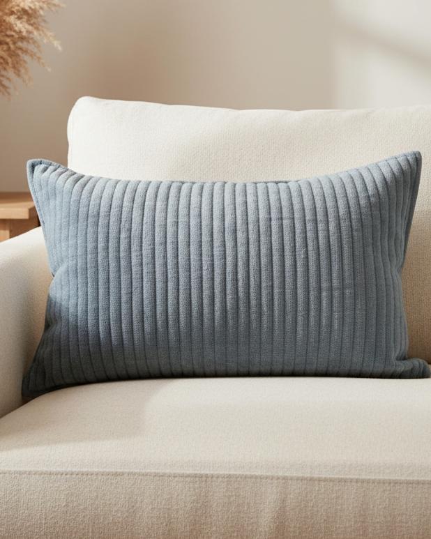 Blue quilted soft stripe square linen cushion with inner from Malini, featuring a comfortable and stylish soft furnishings design.