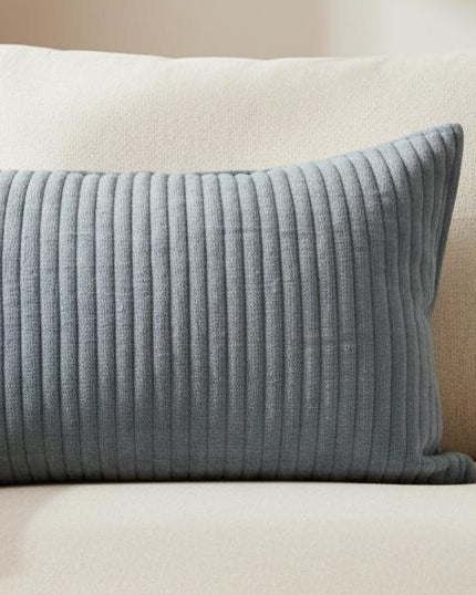 Blue quilted linen cushion with soft stripe pattern and inner filling, by Malini, ideal for cozy soft furnishings.
