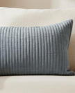 Blue quilted linen cushion with soft stripe pattern and inner filling, by Malini, ideal for cozy soft furnishings.