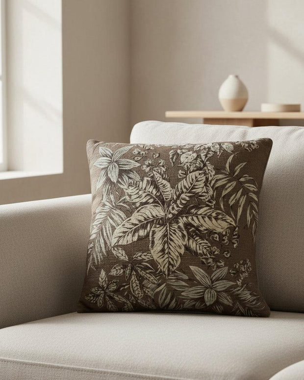 Brown vintage floral printed cushion cover from Malini, soft furnishings with intricate floral design and cozy fabric.