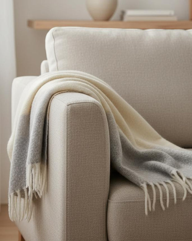 Coastal blue and neutral Malini mohair blanket throw, soft furnishings, showcasing plush, cozy fabric with elegant color blending.