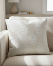 Cream paisley square cushion cover from Malini soft furnishings, featuring a soft fabric with intricate paisley patterns.