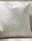 Cream paisley square cushion cover by Malini, soft furnishings with intricate paisley design on fabric.