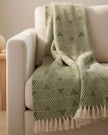 Malini Haven Triangle Green Blanket Throw made of soft furnishings fabric, featuring a geometric green triangle pattern.