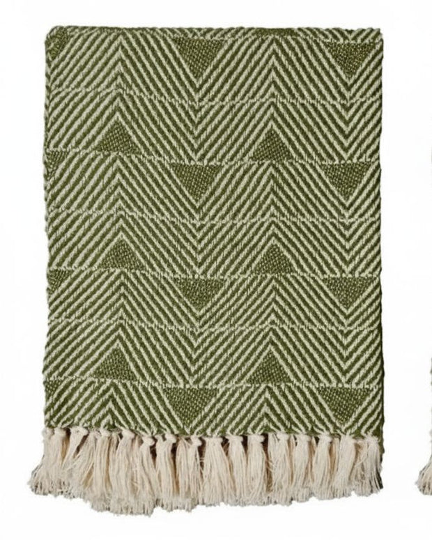 Malini Haven Triangle Green Blanket Throw, soft furnishings with a stylish triangle pattern in vibrant green, draped for display.