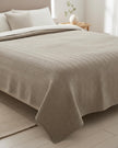 Malini Henderson taupe king size quilted bedspread with soft, textured quilting for a luxurious bedroom look.