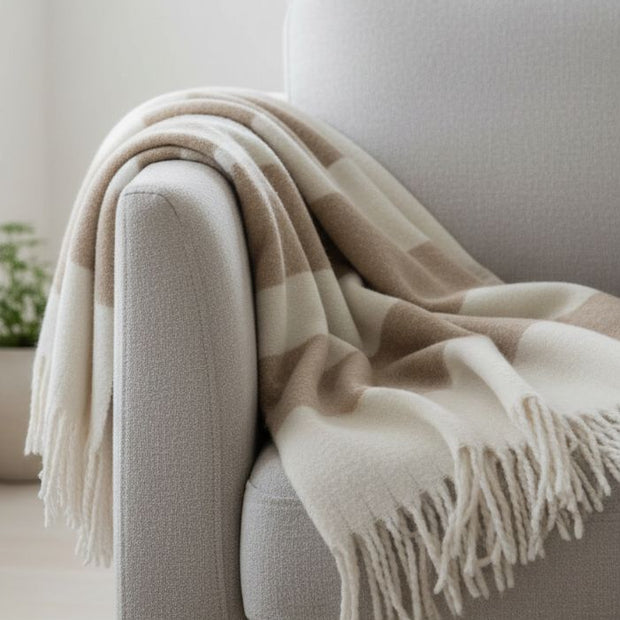 Malini Kalix taupe blanket throw made of soft furnishings, featuring a cozy, textured taupe fabric for comfortable home decor.