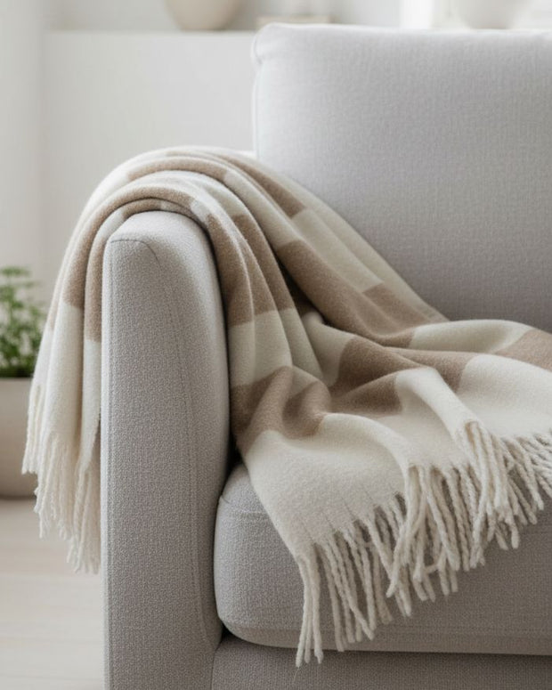 Malini Kalix taupe blanket throw made of soft furnishings, featuring a cozy, textured taupe fabric for comfortable home decor.