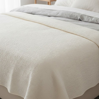 Malini white queen-sized quilt bedspread with a neutral stone-washed finish, soft furnishings for cozy bedroom decor.
