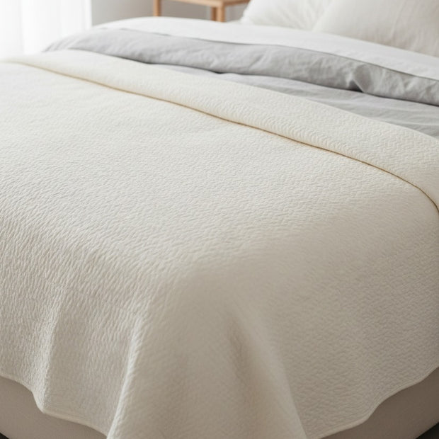 Malini white queen-sized quilt bedspread with a neutral stone-washed finish, soft furnishings for cozy bedroom decor.