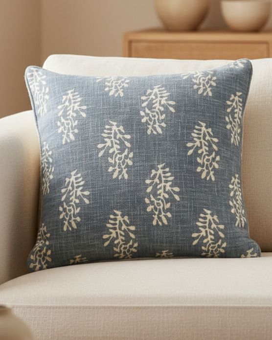 Ocean blue cushion cover with a block floral pattern by Malini, made from soft furnishings fabric, featuring vibrant flower design.