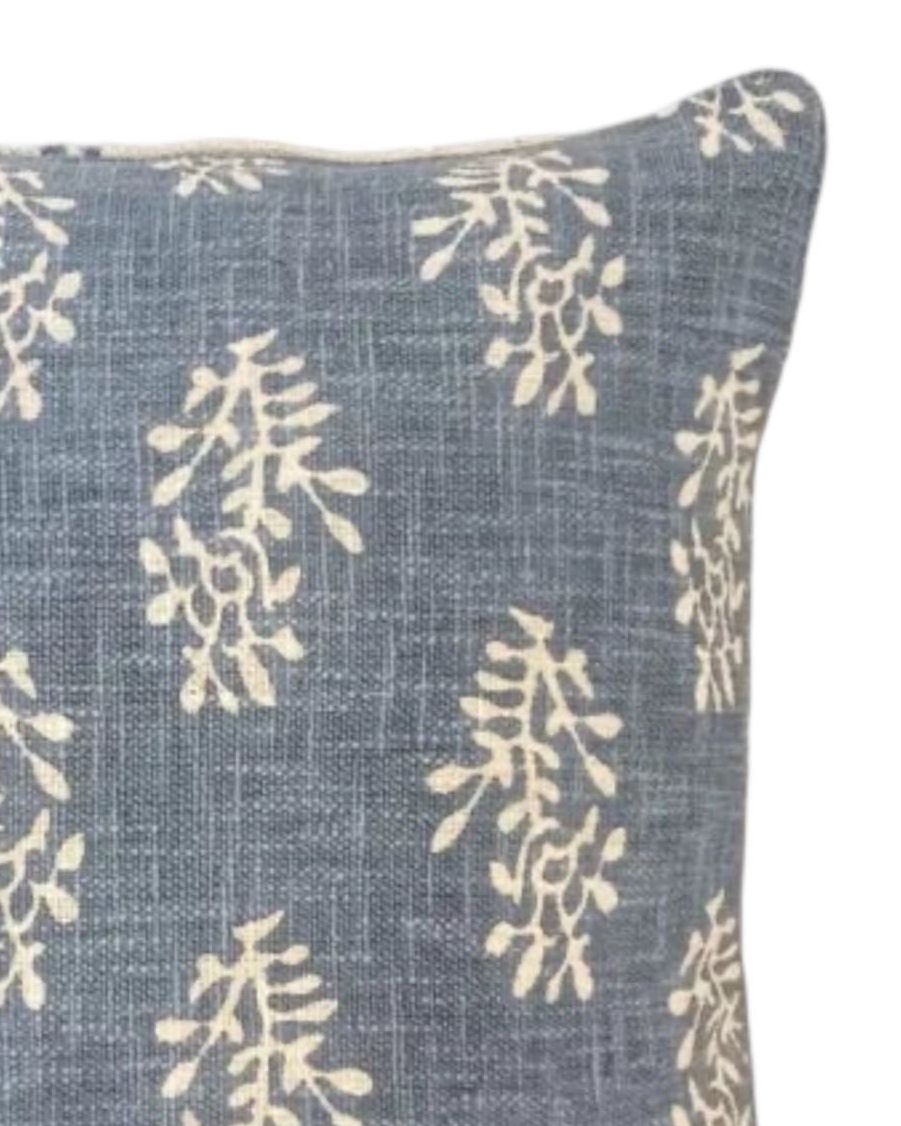 Ocean blue cushion cover with a block flower pattern from Malini's soft furnishings collection.