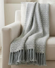 Ocean blue diamond weave cotton throw by Malini, showcasing soft, textured fabric perfect for cozy home décor.