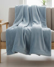 Ocean blue Mia fleece throw blanket by Malini, soft furnishings, cozy and lightweight with plush fleece material and decorative edges.