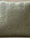Olive green textured square cushion cover from Malini, soft furnishings with a cozy, fabric surface and modern design.