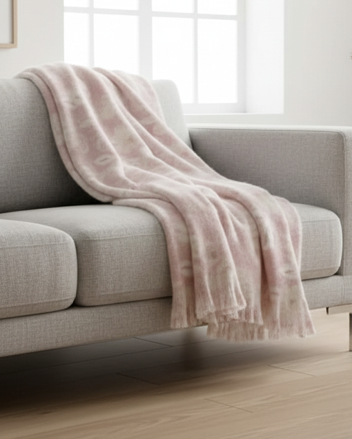 Pale pink floral faux mohair throw blanket from Malini, soft and cozy for home decor and comfort.