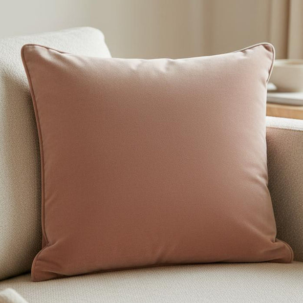 Rose pink velvet cushion cover with piped edges from Malini, soft furnishings accessory for cozy home decor.