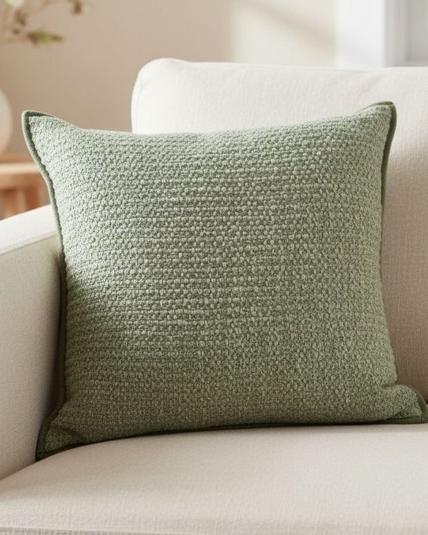 Sage green textured cushion cover by Malini, soft furnishings, showing close-up of fabric and stylish design