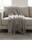 Malini Serena grey mohair-style blanket throw, soft furnishings with a cozy, textured appearance for home decor.