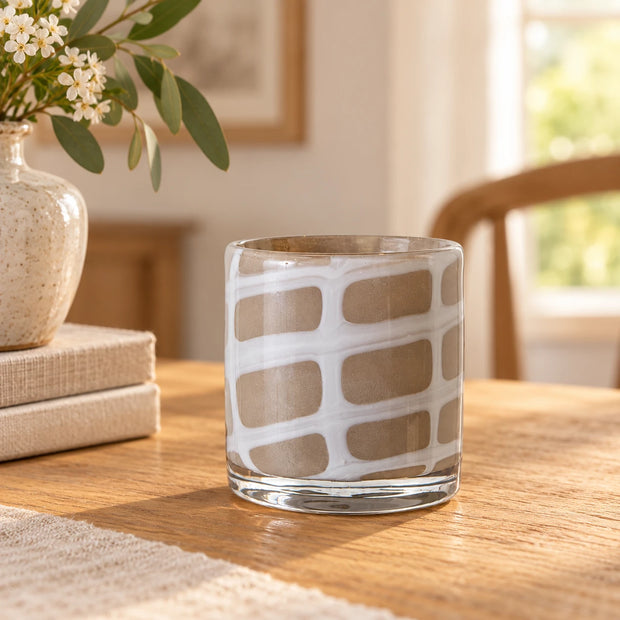Medium Beige Glass Tealight Holder — white irregular grid design empty on oak table