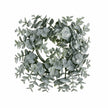 Complete frosted eucalyptus candle wreath with grey-green leaves on a white background.
