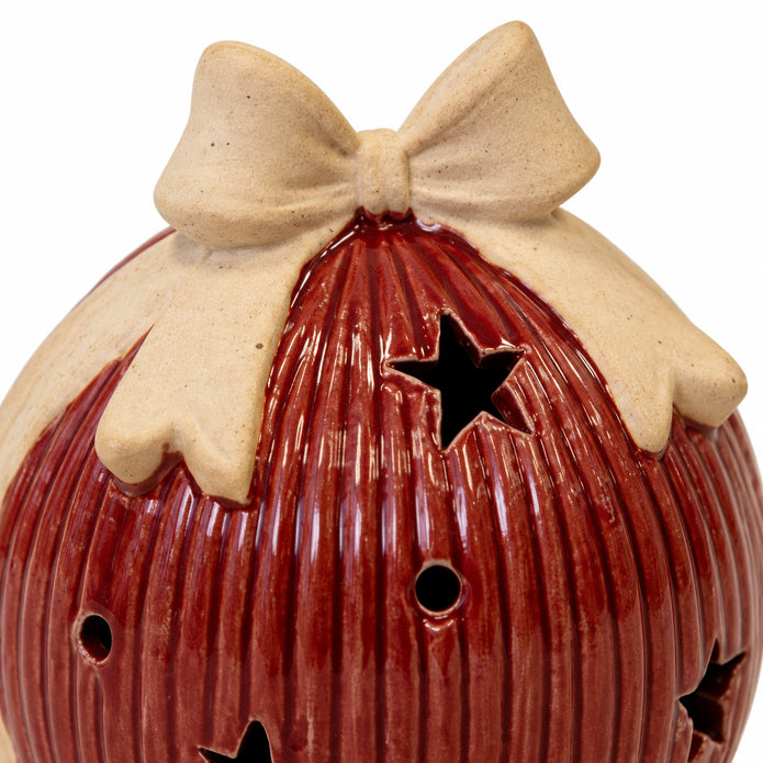 Studio close-up of the cream ceramic bow and red ribbed glaze